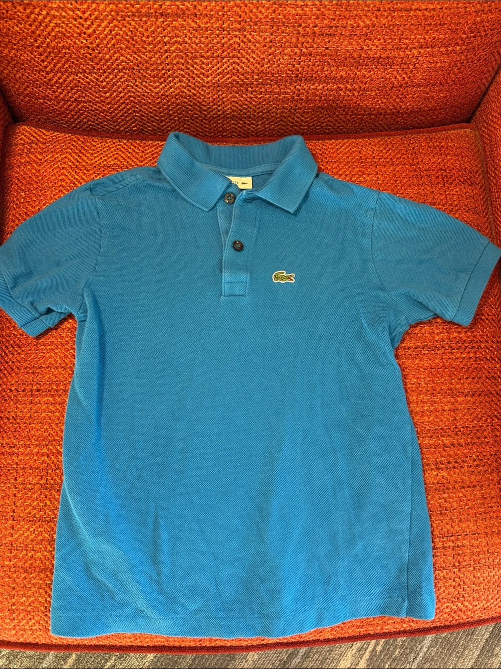 Lacoste classic blue polo shirt size 10 fits more 7/8 in my opinion